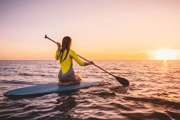 woman paddleboarding