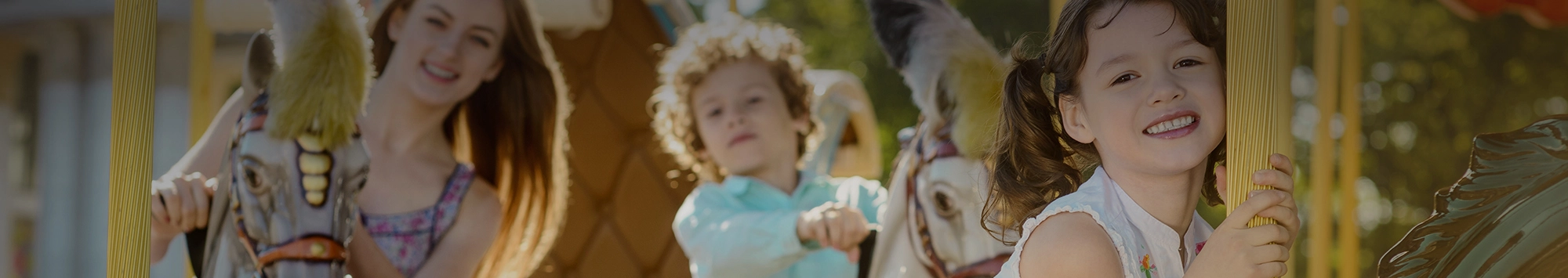 family riding carousel