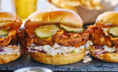fried chicken sandwich with pickles and coleslaw