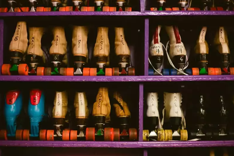 roller skates lined up on a shelf