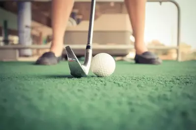 close up of a golf ball at a driving range