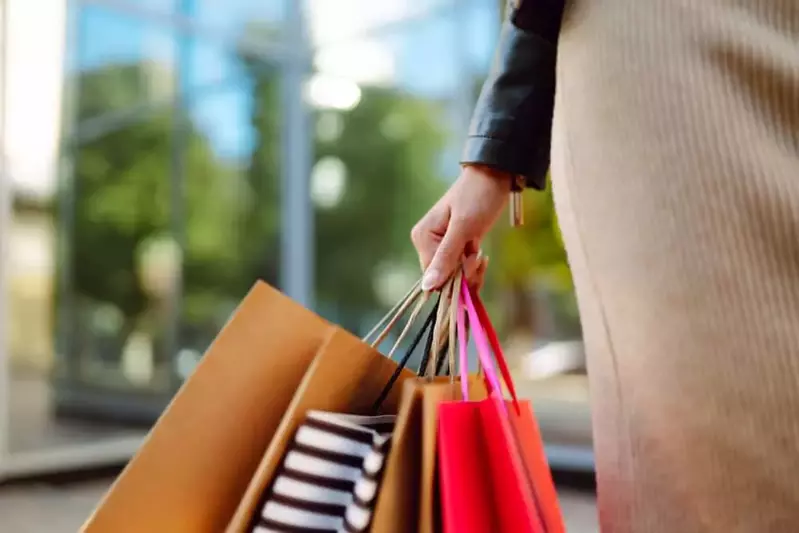 woman carrying shopping bags