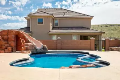 zion reunion poolhouse with a slide