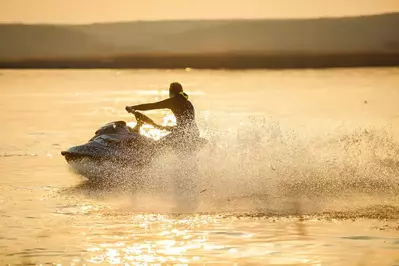 person on a jet ski on a lake