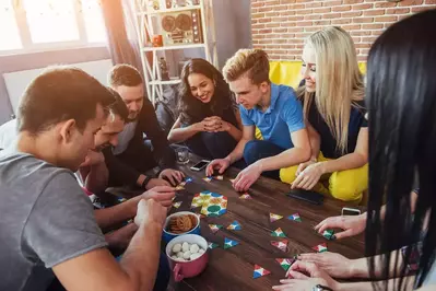 group of friends playing a board game