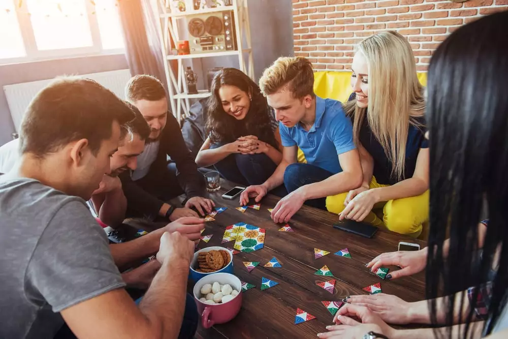 group of friends playing a board game