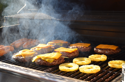 burgers and pineapple on a grill
