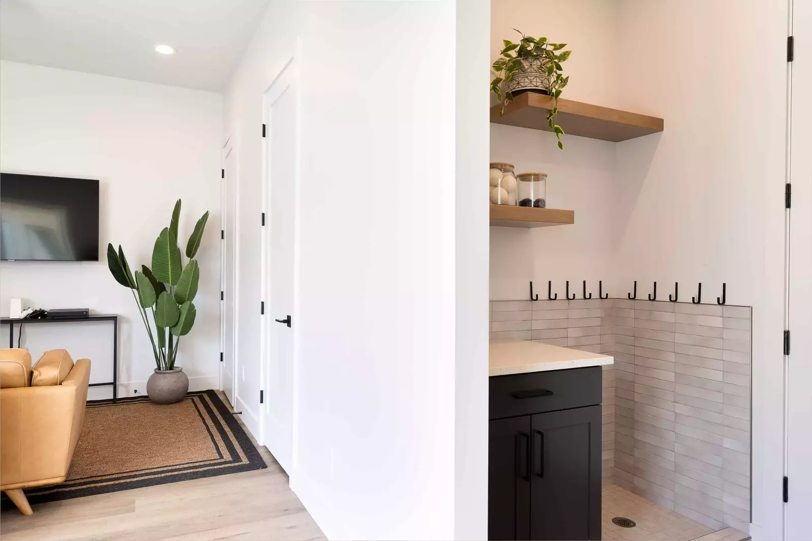 Laundry Room with 2 Sets of Washers and Dryers