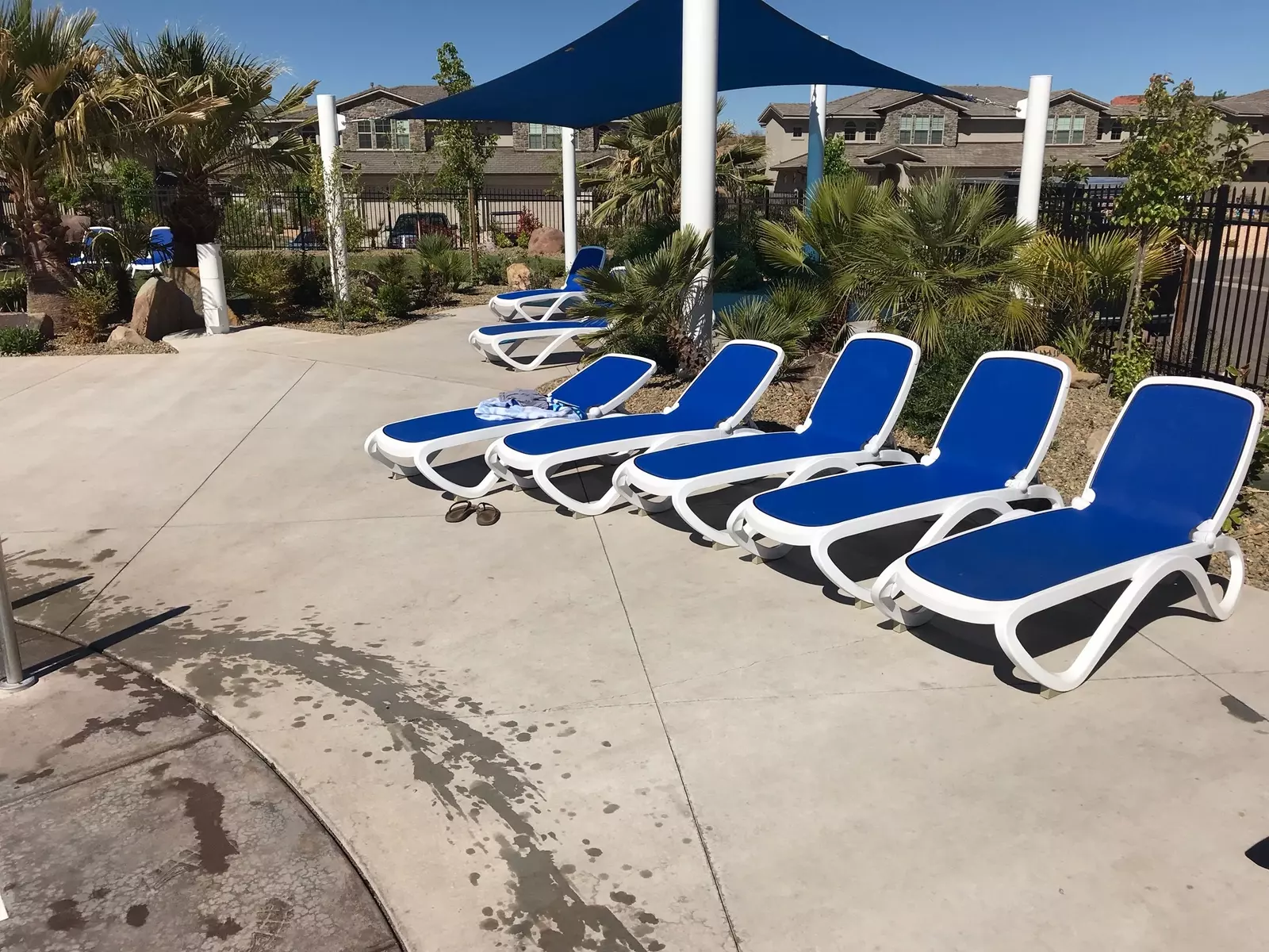 Community Pool Area with Lounge Chairs