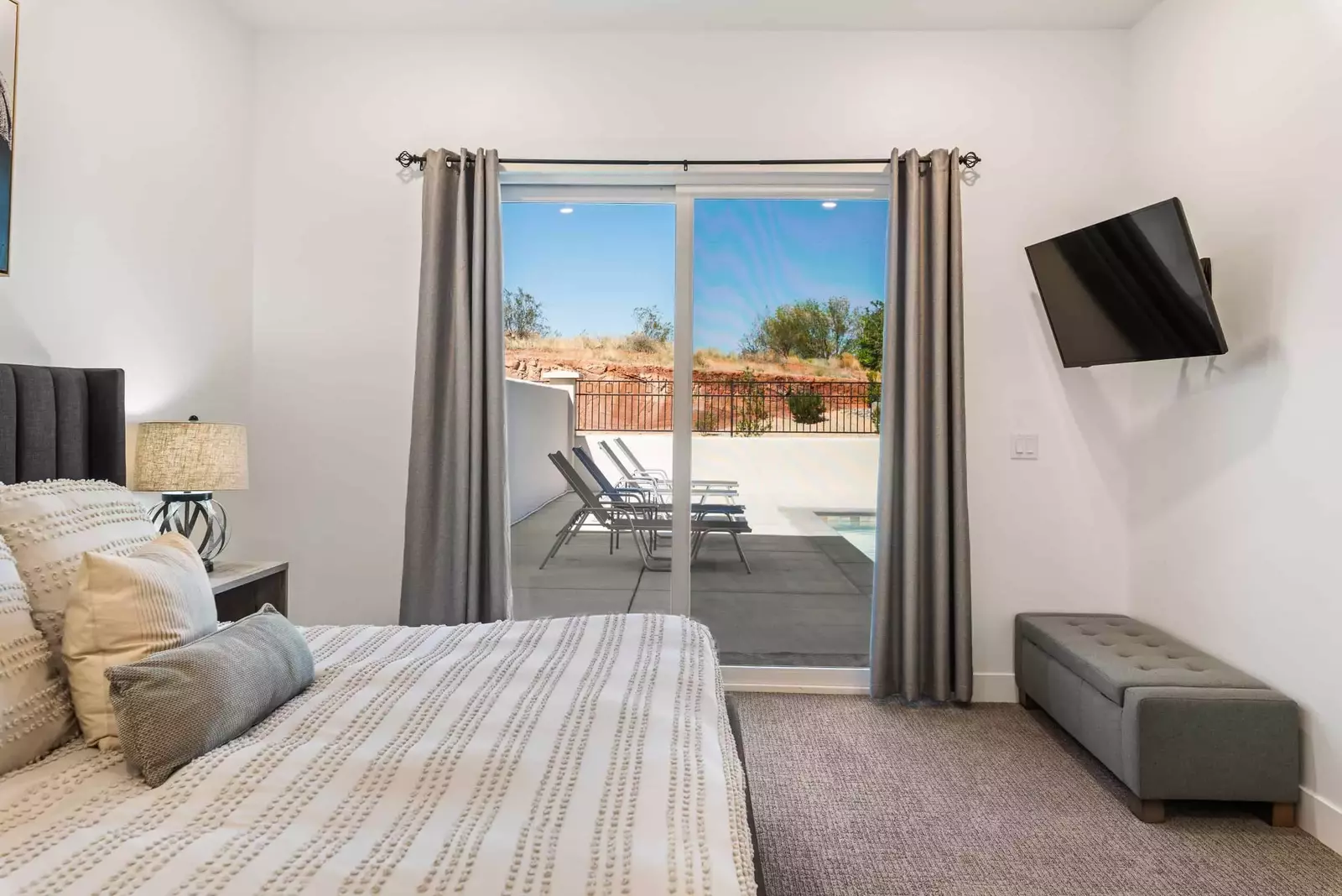Master Bedroom 1 with King and TV and Patio Access