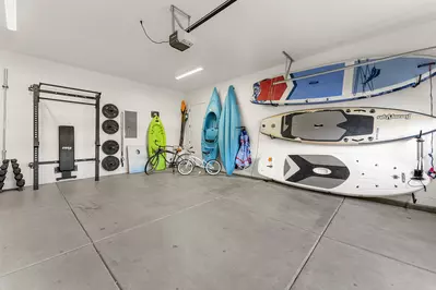 Your adventure gear awaits in this spacious garage - grab kayaks, paddleboards, and bikes for endless water and land exploration.