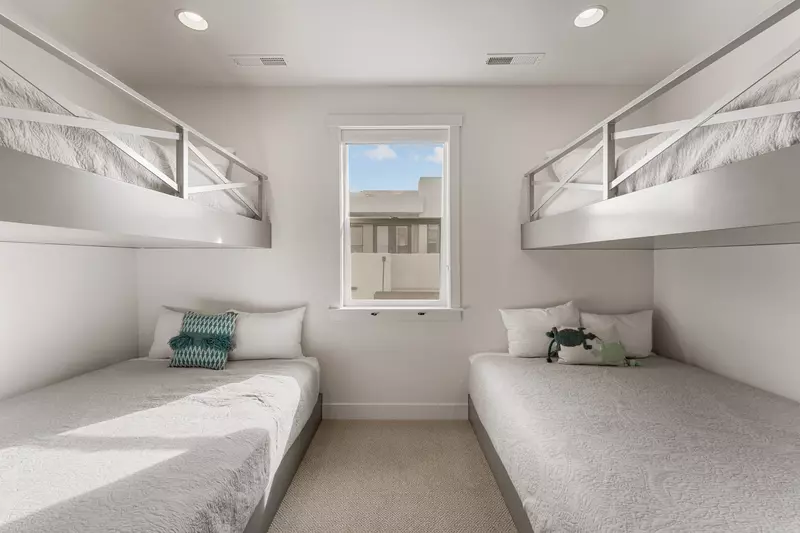 Sleep soundly in these custom built-in bunks, perfect for kids or groups seeking cozy, space-efficient comfort.