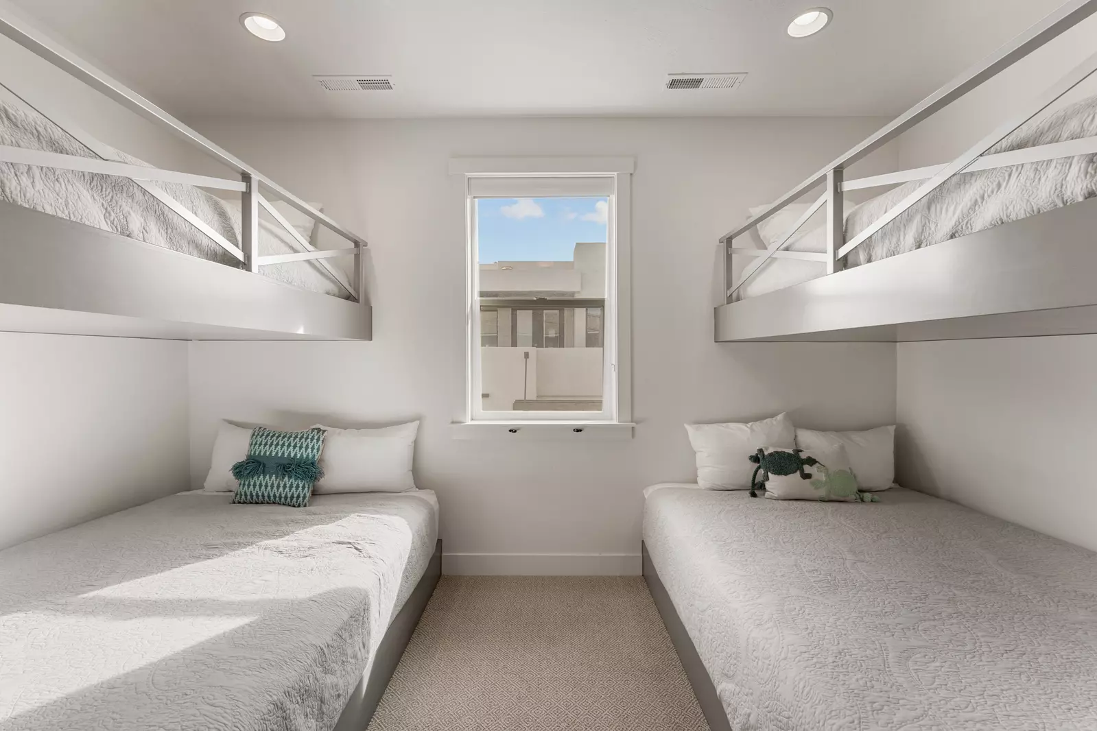 Sleep soundly in these custom built-in bunks, perfect for kids or groups seeking cozy, space-efficient comfort.