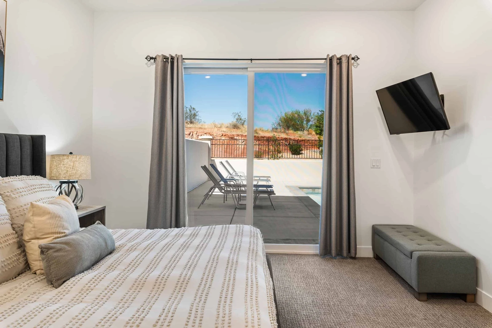 Master Bedroom 1 with King and TV and Patio Access