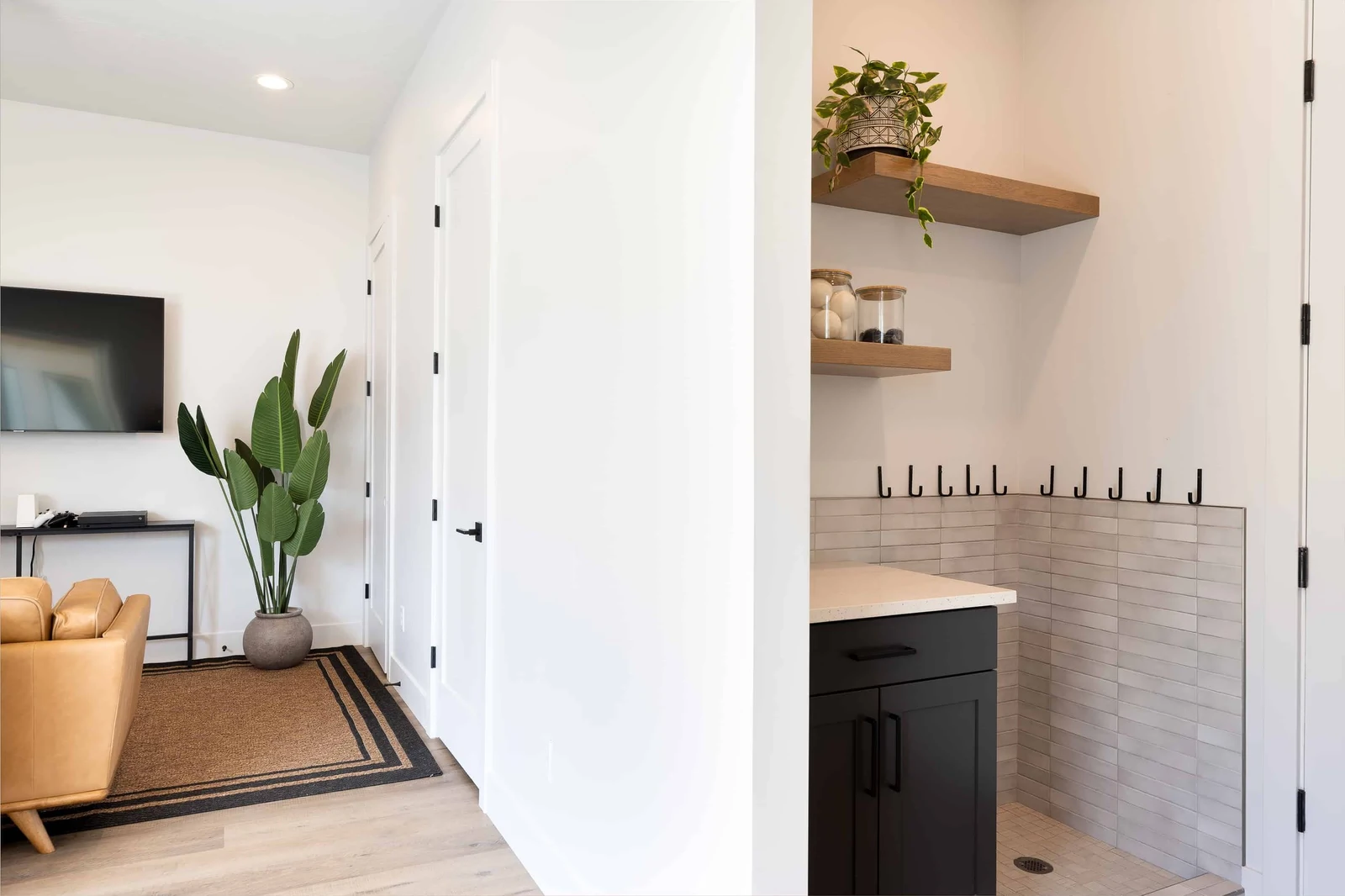 Laundry Room with 2 Sets of Washers and Dryers