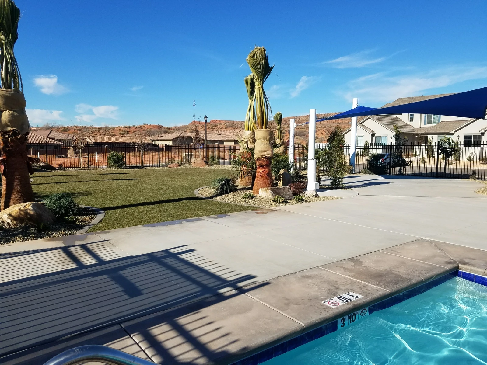 Community Pool cover and grassy area